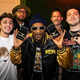 Snoop Dog poses with members of FaZe Clan after signing on as a member of the board of directors.